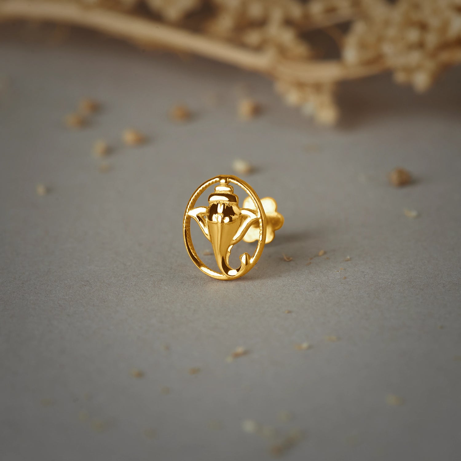 Divine Trunk -- 18K Ganeshji-Inspired Nose Pin Designs in Gold For Female