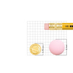 Gold nose pin displayed beside pencil for size comparison highlighting precise craftsmanship and small size