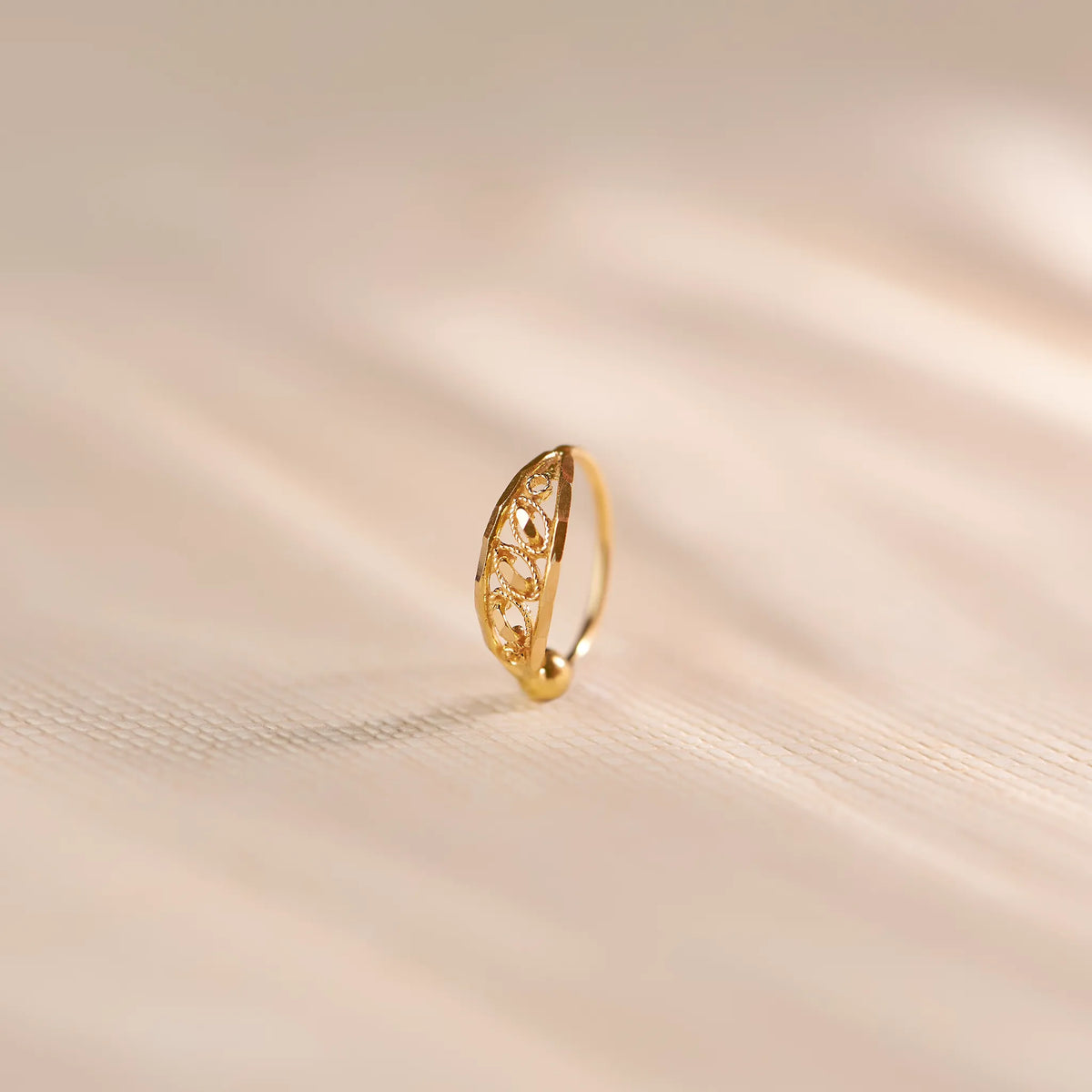 Elegant real gold nose ring with delicate filigree design, lightweight everyday gold nose ring for women, BIS hallmarked 18k gold nose jewellery by Yuvora, minimal traditional Indian nose pin perfect for daily wear, gifting, bridal and modern ethnic styling.