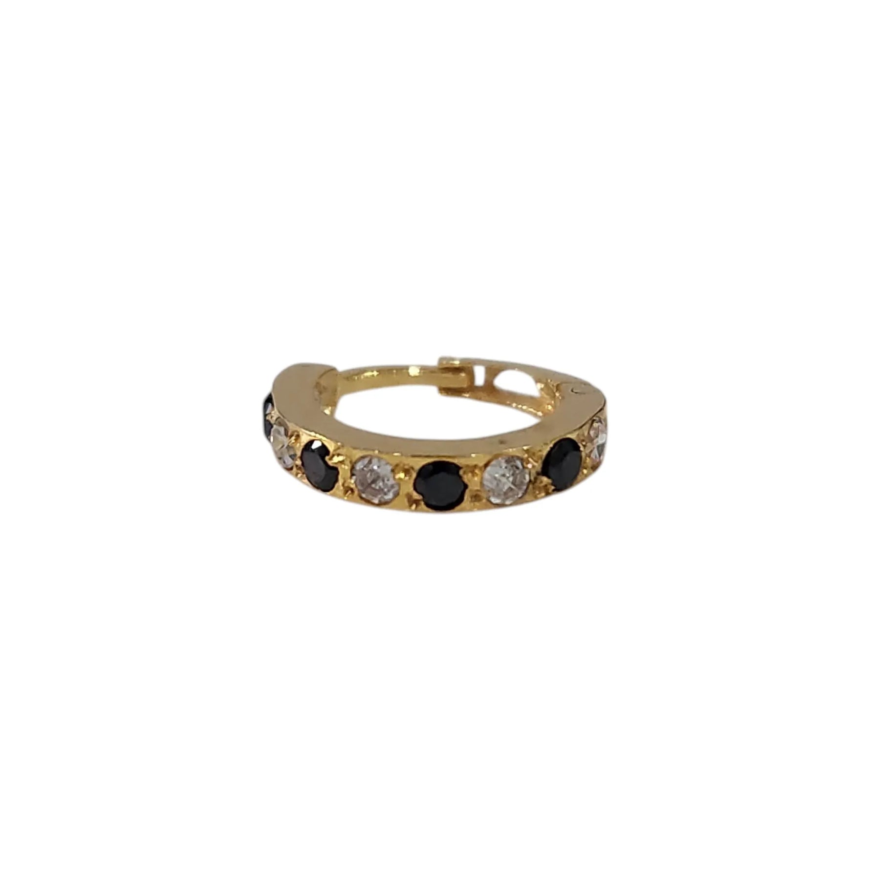 Vertical close up of stone studded 18K gold hoop nose ring on a white background highlighting its sleek circular design
